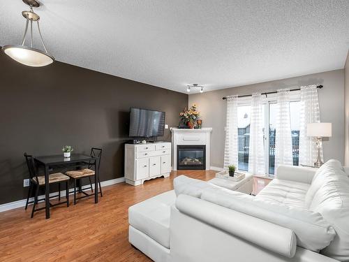 404A 6 Spruce Ridge Drive, Spruce Grove, AB - Indoor Photo Showing Living Room With Fireplace