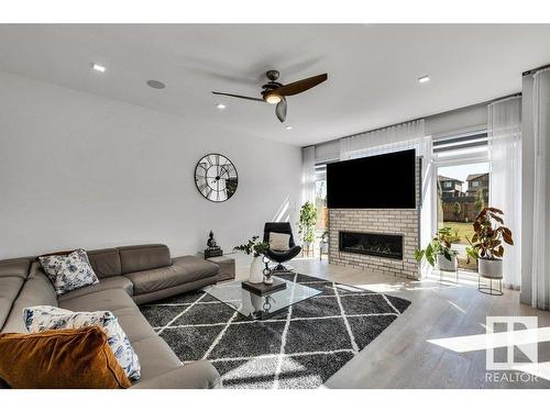 5819 28 Street, Rural Leduc County, AB - Indoor Photo Showing Living Room With Fireplace