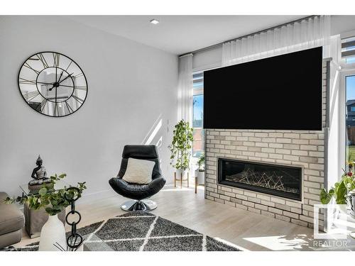 5819 28 Street, Rural Leduc County, AB - Indoor Photo Showing Living Room With Fireplace