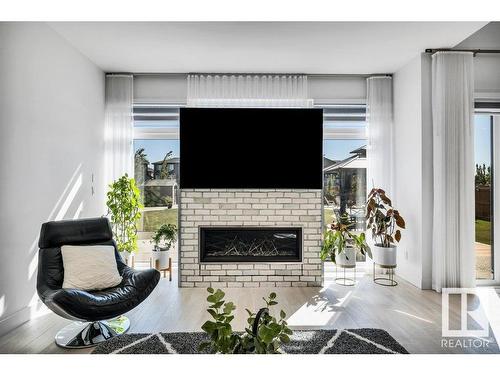 5819 28 Street, Rural Leduc County, AB - Indoor Photo Showing Living Room With Fireplace