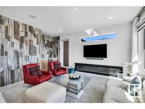 5819 28 Street, Rural Leduc County, AB - Indoor Photo Showing Living Room With Fireplace