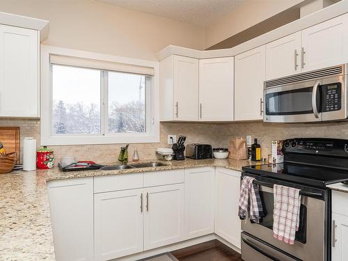 304 10524 77 Avenue, Edmonton, AB - Indoor Photo Showing Kitchen With Double Sink