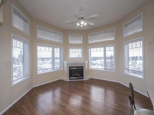 417 2420 108 Street Nw, Edmonton, AB - Indoor Photo Showing Living Room With Fireplace