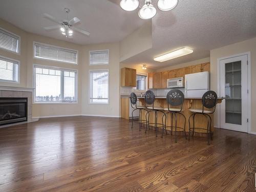 417 2420 108 Street Nw, Edmonton, AB - Indoor Photo Showing Other Room With Fireplace