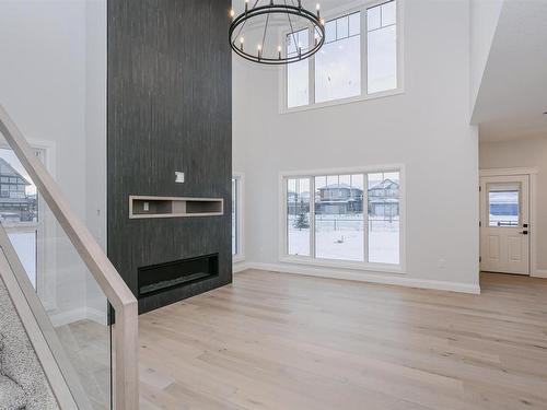 202 Edgewater Circle, Leduc, AB - Indoor Photo Showing Other Room With Fireplace