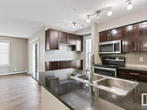 337 3315 James Mowatt Trail, Edmonton, AB - Indoor Photo Showing Kitchen With Double Sink