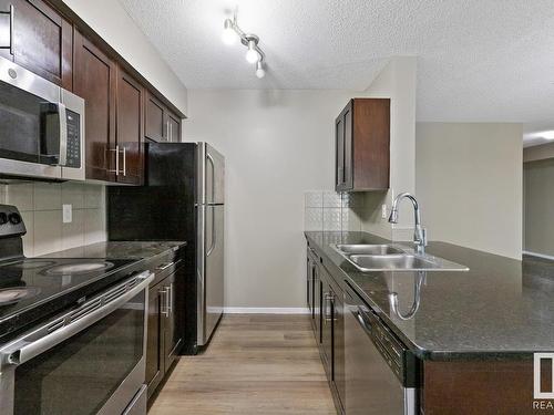 337 3315 James Mowatt Trail, Edmonton, AB - Indoor Photo Showing Kitchen With Double Sink