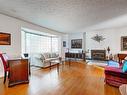 10635 59 Street, Edmonton, AB  - Indoor Photo Showing Living Room With Fireplace 