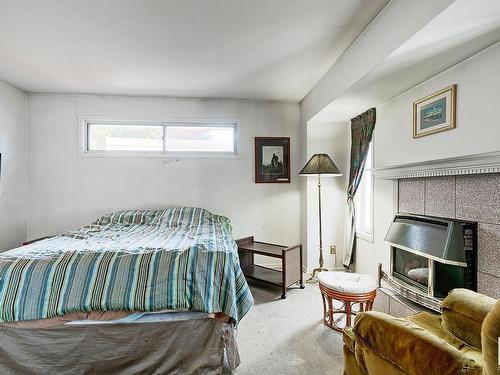 10635 59 Street, Edmonton, AB - Indoor Photo Showing Bedroom With Fireplace