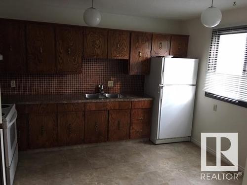 5125,5127,5129 56 Avenue, Viking, AB - Indoor Photo Showing Kitchen With Double Sink