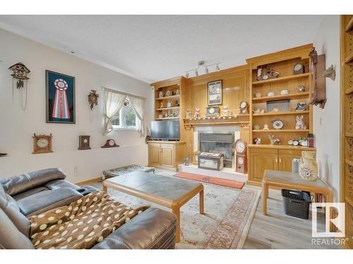 229 Northmount Drive, Wetaskiwin, AB - Indoor Photo Showing Living Room With Fireplace