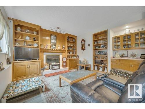 229 Northmount Drive, Wetaskiwin, AB - Indoor Photo Showing Living Room With Fireplace