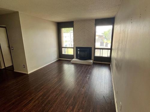 58 Woodbine Road, Sherwood Park, AB - Indoor Photo Showing Living Room With Fireplace