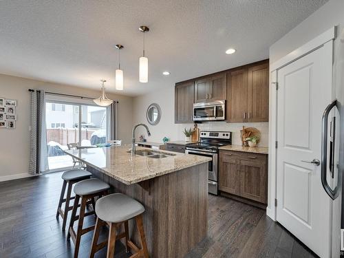 56 Redding Way, Fort Saskatchewan, AB - Indoor Photo Showing Kitchen With Stainless Steel Kitchen With Double Sink With Upgraded Kitchen