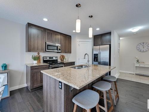 56 Redding Way, Fort Saskatchewan, AB - Indoor Photo Showing Kitchen With Stainless Steel Kitchen With Double Sink With Upgraded Kitchen