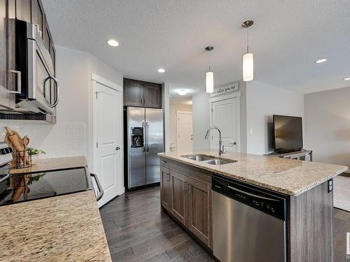 56 Redding Way, Fort Saskatchewan, AB - Indoor Photo Showing Kitchen With Stainless Steel Kitchen With Double Sink With Upgraded Kitchen