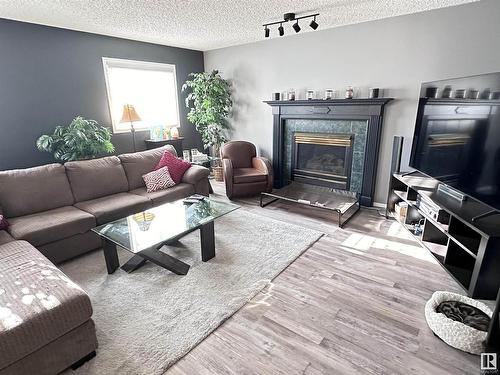 10824 106A, Westlock, AB - Indoor Photo Showing Living Room With Fireplace