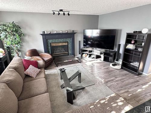 10824 106A, Westlock, AB - Indoor Photo Showing Living Room With Fireplace