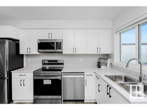 41 1530 Tamarack Boulevard Nw, Edmonton, AB - Indoor Photo Showing Kitchen With Stainless Steel Kitchen With Double Sink