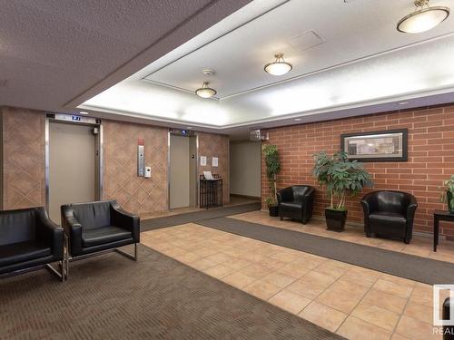 1302 9917 110 Street, Edmonton, AB - Indoor Photo Showing Other Room With Fireplace