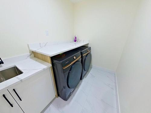 4202 38A Street, Beaumont, AB - Indoor Photo Showing Laundry Room