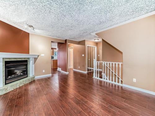 28 225 Blackburn E, Edmonton, AB - Indoor Photo Showing Living Room With Fireplace