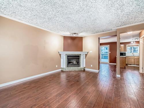 28 225 Blackburn E, Edmonton, AB - Indoor Photo Showing Living Room With Fireplace