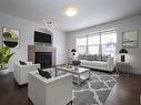 883 Oakland Boulevard, Devon, AB  - Indoor Photo Showing Living Room With Fireplace 