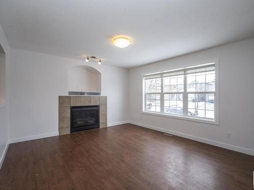 883 Oakland Boulevard, Devon, AB - Indoor Photo Showing Living Room With Fireplace