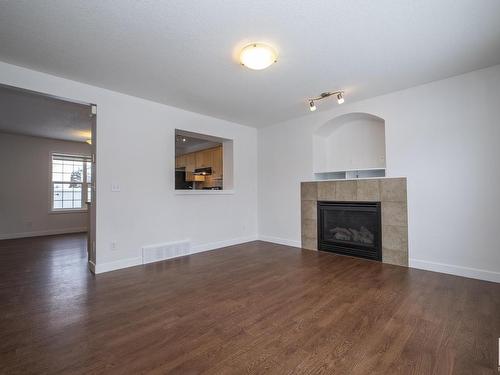 883 Oakland Boulevard, Devon, AB - Indoor Photo Showing Living Room With Fireplace