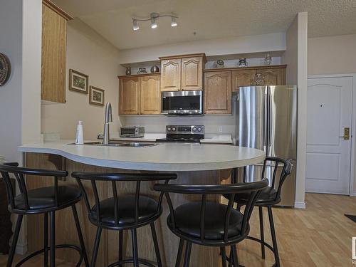 112 14259 50 Street, Edmonton, AB - Indoor Photo Showing Kitchen With Stainless Steel Kitchen With Double Sink