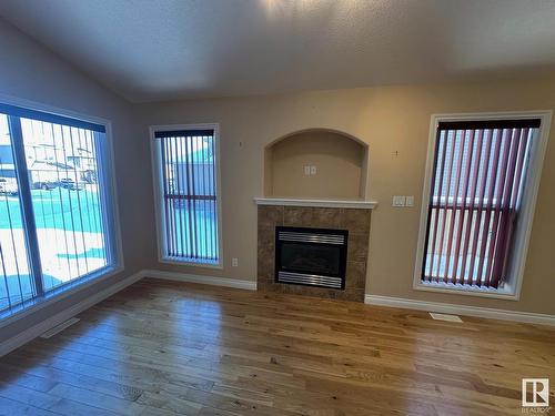 26 Willowdale Place, Stony Plain, AB - Indoor Photo Showing Other Room With Fireplace