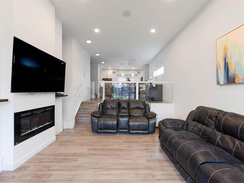 2426 Wonnacott Court, Edmonton, AB - Indoor Photo Showing Living Room With Fireplace