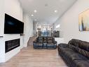 2426 Wonnacott Court, Edmonton, AB  - Indoor Photo Showing Living Room With Fireplace 