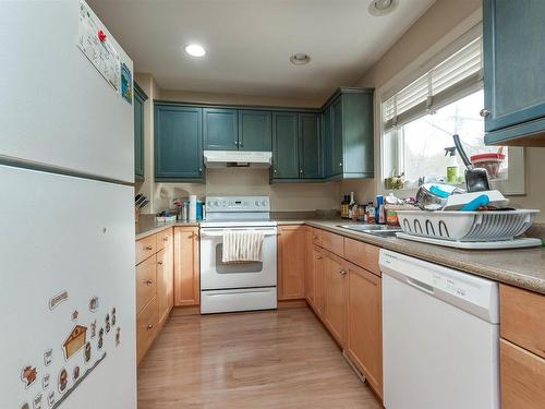 10651 68 Ave 6711 107 St Avenue, Edmonton, AB - Indoor Photo Showing Kitchen With Double Sink