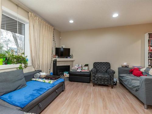 10651 68 Ave 6711 107 St Avenue, Edmonton, AB - Indoor Photo Showing Living Room With Fireplace