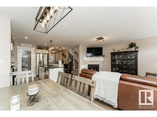 3047 Harvey Crescent, Edmonton, AB - Indoor Photo Showing Dining Room With Fireplace