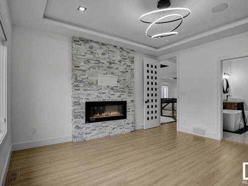 115 38 Street, Edmonton, AB - Indoor Photo Showing Living Room With Fireplace