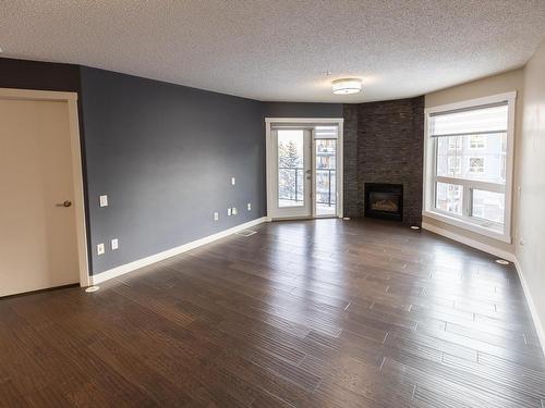 405 7951 96 Street, Edmonton, AB - Indoor Photo Showing Living Room With Fireplace