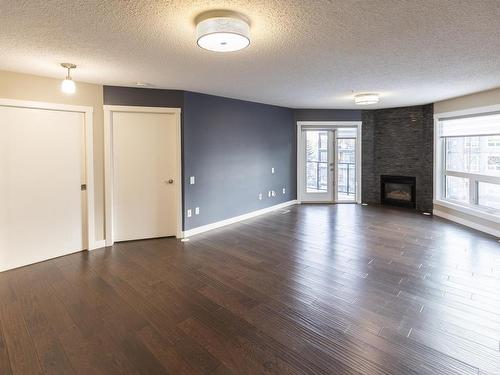 405 7951 96 Street, Edmonton, AB - Indoor Photo Showing Living Room With Fireplace