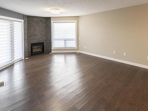 405 7951 96 Street, Edmonton, AB - Indoor Photo Showing Living Room With Fireplace