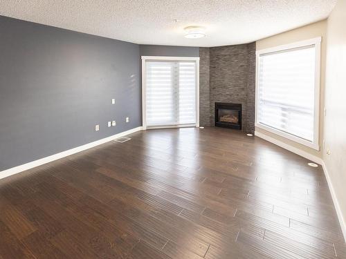 405 7951 96 Street, Edmonton, AB - Indoor Photo Showing Living Room With Fireplace