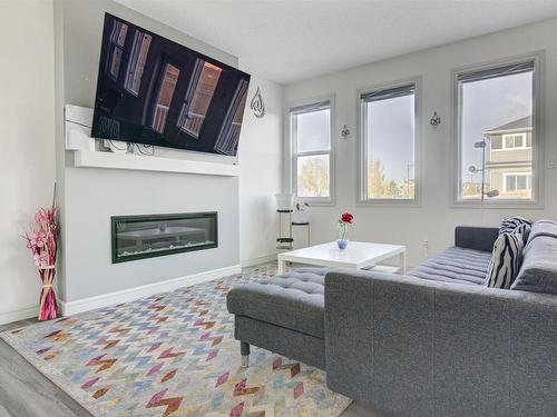 5795 Cautley Crescent, Edmonton, AB - Indoor Photo Showing Living Room With Fireplace