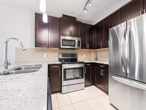 410 5151 Windermere Bv, Edmonton, AB - Indoor Photo Showing Kitchen With Stainless Steel Kitchen With Double Sink