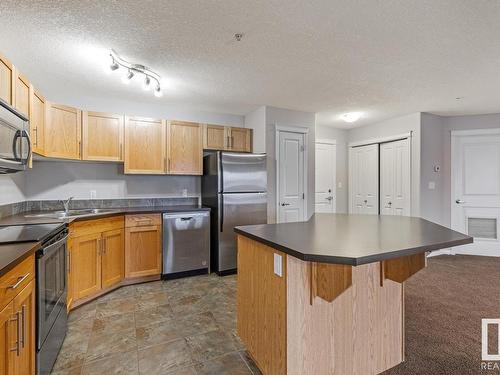 222 300 Spruce Ridge Road, Spruce Grove, AB - Indoor Photo Showing Kitchen With Stainless Steel Kitchen With Double Sink