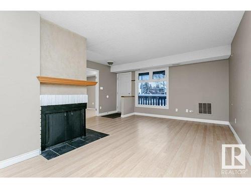 5756 172 Street, Edmonton, AB - Indoor Photo Showing Other Room With Fireplace