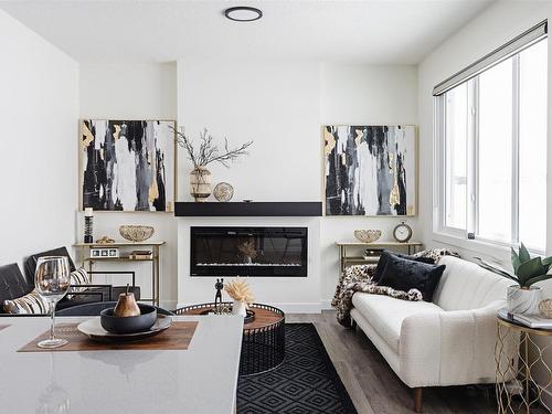 173 Starling, Fort Saskatchewan, AB - Indoor Photo Showing Other Room With Fireplace