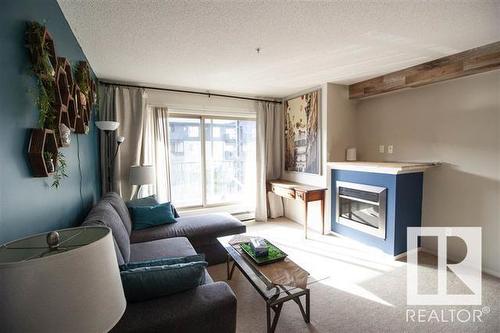 320 17003 67 Avenue, Edmonton, AB - Indoor Photo Showing Living Room With Fireplace