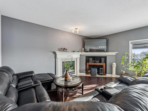 7111 168 Avenue, Edmonton, AB - Indoor Photo Showing Living Room With Fireplace