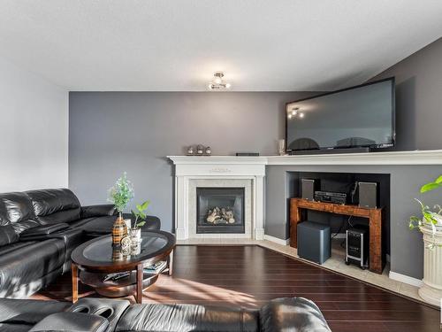 7111 168 Avenue, Edmonton, AB - Indoor Photo Showing Living Room With Fireplace